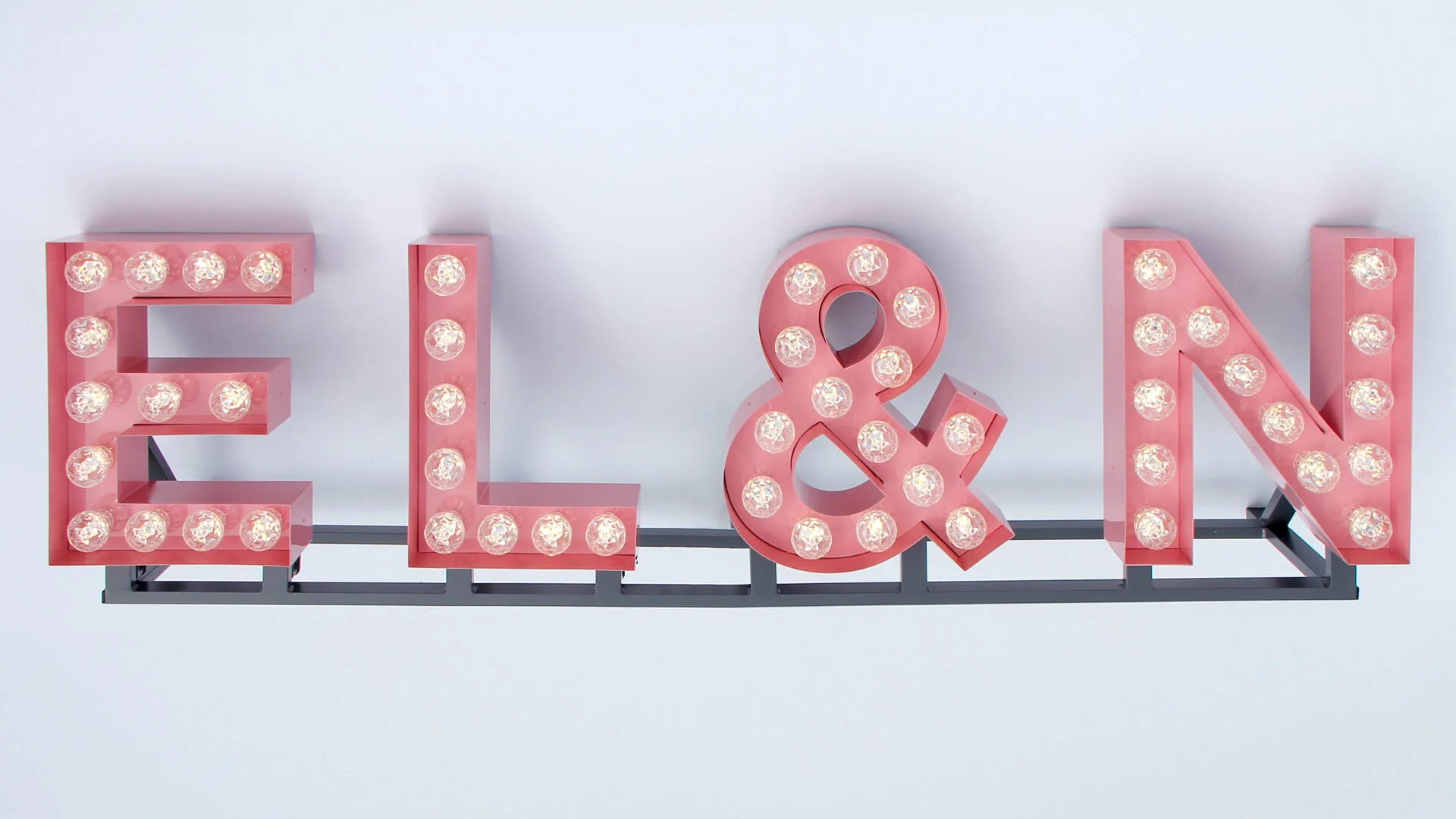 Light bulb letters in pink